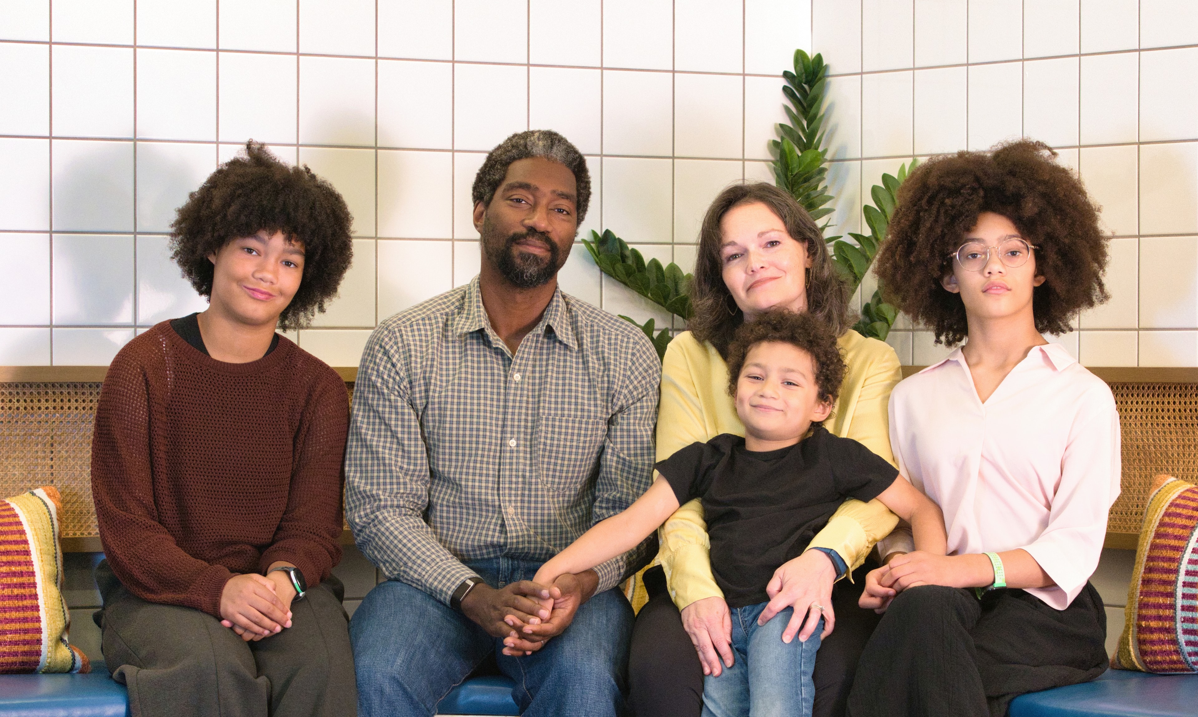 Multicultural family portrait — warm studio photography